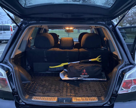 Чорний Міцубісі Аутлендер, об'ємом двигуна 2 л та пробігом 271 тис. км за 6799 $, фото 8 на Automoto.ua