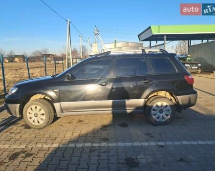 Черный Мицубиси Аутлендер, объемом двигателя 2 л и пробегом 190 тыс. км за 8000 $, фото 3 на Automoto.ua