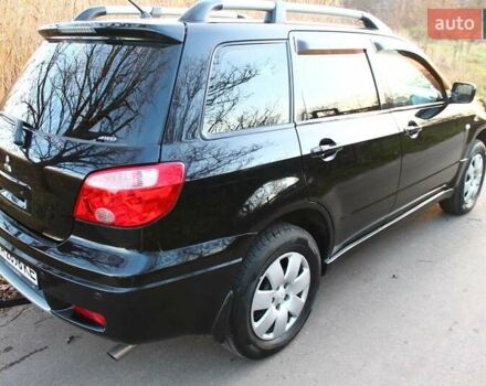 Черный Мицубиси Аутлендер, объемом двигателя 2 л и пробегом 190 тыс. км за 6900 $, фото 20 на Automoto.ua