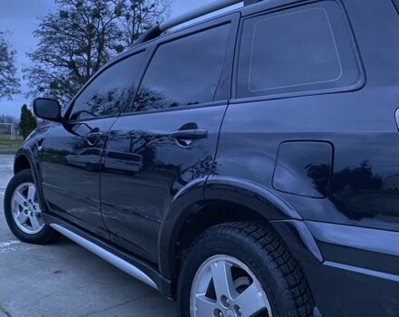 Чорний Міцубісі Аутлендер, об'ємом двигуна 2 л та пробігом 271 тис. км за 6799 $, фото 2 на Automoto.ua