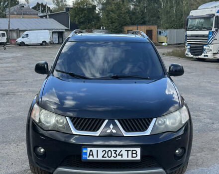 Черный Мицубиси Аутлендер, объемом двигателя 2.36 л и пробегом 286 тыс. км за 9200 $, фото 1 на Automoto.ua