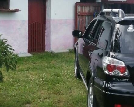 Чорний Міцубісі Аутлендер, об'ємом двигуна 2 л та пробігом 208 тис. км за 6700 $, фото 2 на Automoto.ua