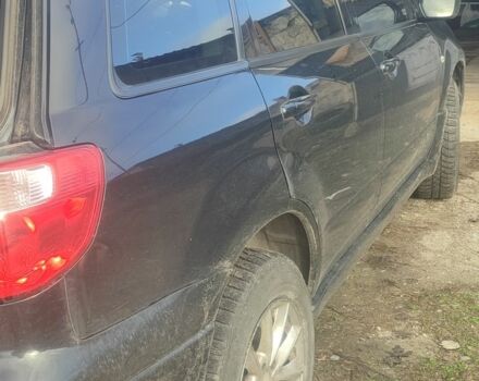 Черный Мицубиси Аутлендер, объемом двигателя 2 л и пробегом 212 тыс. км за 6900 $, фото 3 на Automoto.ua