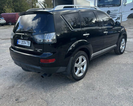 Черный Мицубиси Аутлендер, объемом двигателя 2.36 л и пробегом 286 тыс. км за 9200 $, фото 5 на Automoto.ua