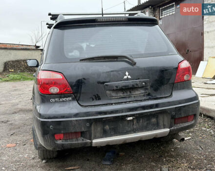 Черный Мицубиси Аутлендер, объемом двигателя 2 л и пробегом 200 тыс. км за 2999 $, фото 4 на Automoto.ua