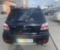 Чорний Міцубісі Аутлендер, об'ємом двигуна 2 л та пробігом 178 тис. км за 6850 $, фото 12 на Automoto.ua