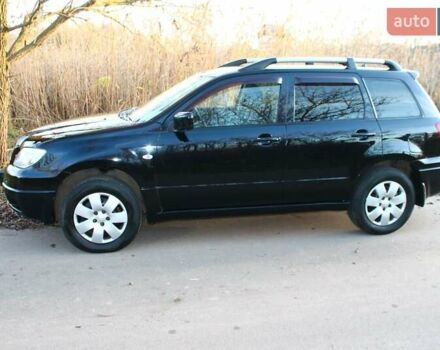 Черный Мицубиси Аутлендер, объемом двигателя 2 л и пробегом 190 тыс. км за 6900 $, фото 25 на Automoto.ua