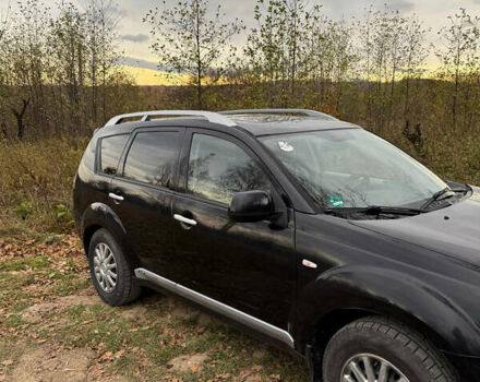 Черный Мицубиси Аутлендер, объемом двигателя 2.18 л и пробегом 233 тыс. км за 9600 $, фото 1 на Automoto.ua