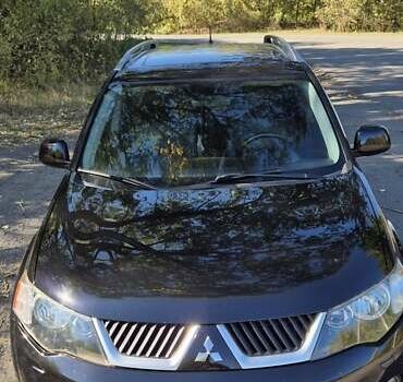 Черный Мицубиси Аутлендер, объемом двигателя 2.4 л и пробегом 178 тыс. км за 9150 $, фото 1 на Automoto.ua