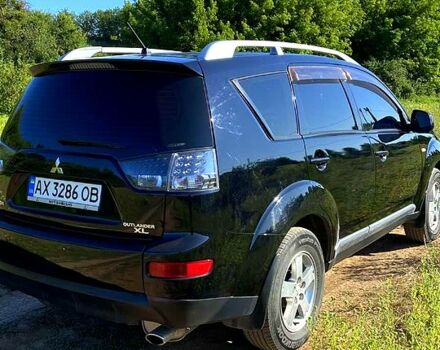 Черный Мицубиси Аутлендер, объемом двигателя 2.4 л и пробегом 217 тыс. км за 7300 $, фото 4 на Automoto.ua