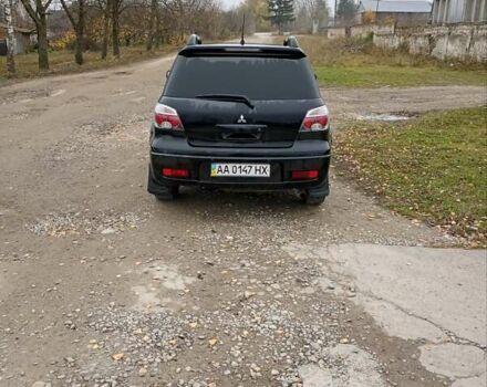 Черный Мицубиси Аутлендер, объемом двигателя 2 л и пробегом 209 тыс. км за 5700 $, фото 11 на Automoto.ua
