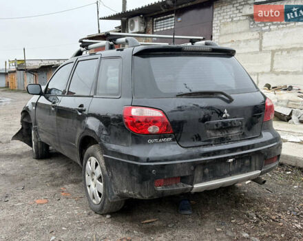 Черный Мицубиси Аутлендер, объемом двигателя 2 л и пробегом 200 тыс. км за 2999 $, фото 3 на Automoto.ua