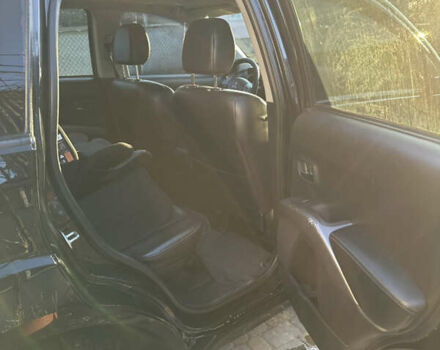 Черный Мицубиси Аутлендер, объемом двигателя 2.36 л и пробегом 253 тыс. км за 9600 $, фото 4 на Automoto.ua