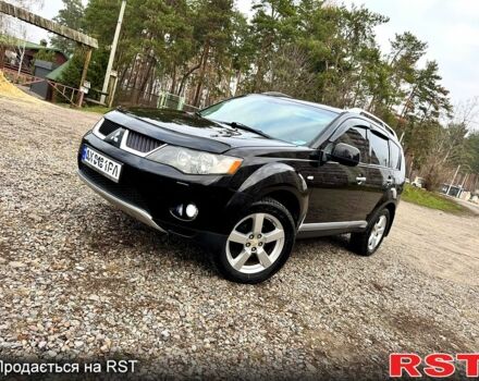 Черный Мицубиси Аутлендер, объемом двигателя 2.4 л и пробегом 229 тыс. км за 9790 $, фото 2 на Automoto.ua