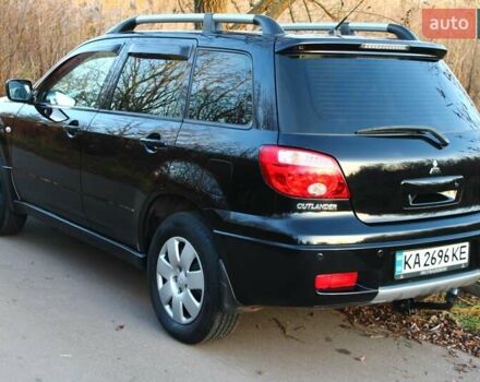 Черный Мицубиси Аутлендер, объемом двигателя 2 л и пробегом 189 тыс. км за 7200 $, фото 16 на Automoto.ua