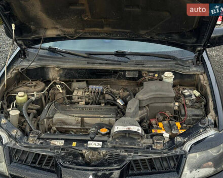 Черный Мицубиси Аутлендер, объемом двигателя 2 л и пробегом 240 тыс. км за 5500 $, фото 21 на Automoto.ua