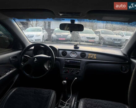 Черный Мицубиси Аутлендер, объемом двигателя 2 л и пробегом 240 тыс. км за 5500 $, фото 12 на Automoto.ua