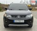 Черный Мицубиси Аутлендер, объемом двигателя 3 л и пробегом 248 тыс. км за 9800 $, фото 1 на Automoto.ua