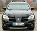 Черный Мицубиси Аутлендер, объемом двигателя 2.4 л и пробегом 245 тыс. км за 6500 $, фото 3 на Automoto.ua
