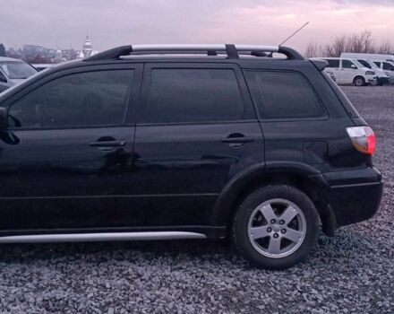 Черный Мицубиси Аутлендер, объемом двигателя 2 л и пробегом 271 тыс. км за 6940 $, фото 4 на Automoto.ua