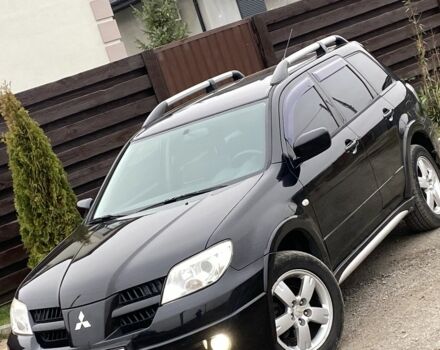Черный Мицубиси Аутлендер, объемом двигателя 2.4 л и пробегом 178 тыс. км за 6900 $, фото 11 на Automoto.ua
