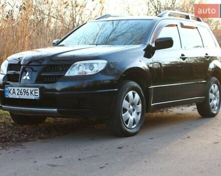 Черный Мицубиси Аутлендер, объемом двигателя 2 л и пробегом 190 тыс. км за 6900 $, фото 22 на Automoto.ua
