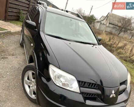Черный Мицубиси Аутлендер, объемом двигателя 2.4 л и пробегом 178 тыс. км за 6900 $, фото 9 на Automoto.ua