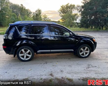 Черный Мицубиси Аутлендер, объемом двигателя 2.4 л и пробегом 208 тыс. км за 10200 $, фото 4 на Automoto.ua