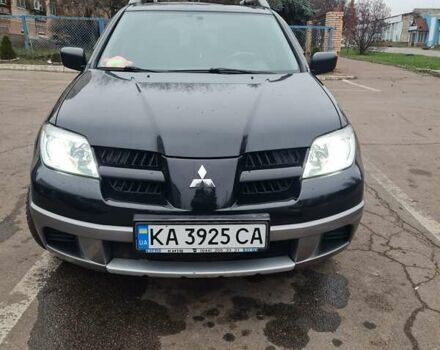 Черный Мицубиси Аутлендер, объемом двигателя 2 л и пробегом 212 тыс. км за 7900 $, фото 1 на Automoto.ua