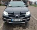 Черный Мицубиси Аутлендер, объемом двигателя 2 л и пробегом 212 тыс. км за 7900 $, фото 1 на Automoto.ua