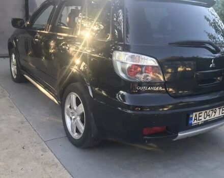 Чорний Міцубісі Аутлендер, об'ємом двигуна 2.38 л та пробігом 207 тис. км за 7000 $, фото 59 на Automoto.ua
