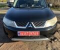 Черный Мицубиси Аутлендер, объемом двигателя 2 л и пробегом 247 тыс. км за 4600 $, фото 1 на Automoto.ua