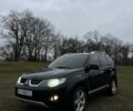 Черный Мицубиси Аутлендер, объемом двигателя 2.4 л и пробегом 230 тыс. км за 8800 $, фото 1 на Automoto.ua