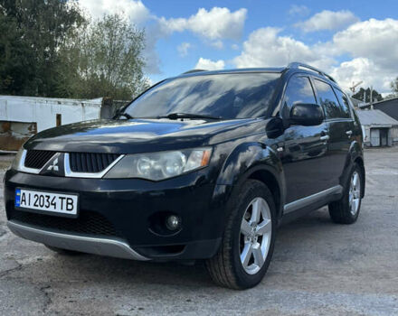 Черный Мицубиси Аутлендер, объемом двигателя 2.36 л и пробегом 286 тыс. км за 9200 $, фото 2 на Automoto.ua