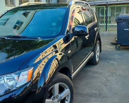 Черный Мицубиси Аутлендер, объемом двигателя 2.36 л и пробегом 246 тыс. км за 9700 $, фото 3 на Automoto.ua