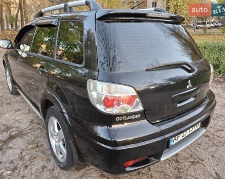 Чорний Міцубісі Аутлендер, об'ємом двигуна 2.38 л та пробігом 245 тис. км за 6800 $, фото 5 на Automoto.ua