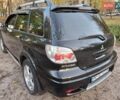 Чорний Міцубісі Аутлендер, об'ємом двигуна 2.38 л та пробігом 245 тис. км за 6800 $, фото 5 на Automoto.ua