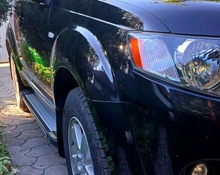 Черный Мицубиси Аутлендер, объемом двигателя 2.4 л и пробегом 184 тыс. км за 7500 $, фото 2 на Automoto.ua