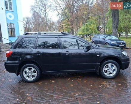 Чорний Міцубісі Аутлендер, об'ємом двигуна 2 л та пробігом 191 тис. км за 7100 $, фото 5 на Automoto.ua