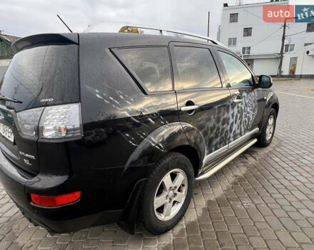 Міцубісі Аутлендер 2008 у Кременчуге на Automoto.ua Чорний Міцубісі Аутлендер, об'ємом двигуна 2.4 л та пробігом 230 тис. км за 6650 $, фото 60 на Automoto.ua