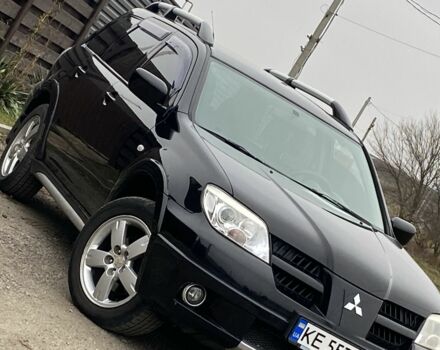 Черный Мицубиси Аутлендер, объемом двигателя 2.4 л и пробегом 178 тыс. км за 6900 $, фото 1 на Automoto.ua
