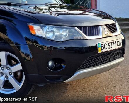 Черный Мицубиси Аутлендер, объемом двигателя 2.4 л и пробегом 189 тыс. км за 7000 $, фото 1 на Automoto.ua