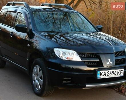 Черный Мицубиси Аутлендер, объемом двигателя 2 л и пробегом 190 тыс. км за 6900 $, фото 9 на Automoto.ua