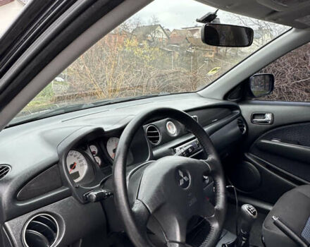 Чорний Міцубісі Аутлендер, об'ємом двигуна 2 л та пробігом 118 тис. км за 8100 $, фото 39 на Automoto.ua