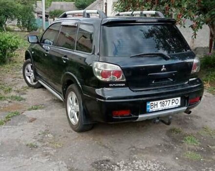Черный Мицубиси Аутлендер, объемом двигателя 2 л и пробегом 240 тыс. км за 6500 $, фото 5 на Automoto.ua