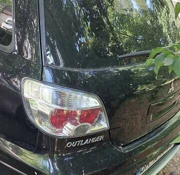 Черный Мицубиси Аутлендер, объемом двигателя 2.4 л и пробегом 150 тыс. км за 6300 $, фото 6 на Automoto.ua