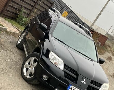 Черный Мицубиси Аутлендер, объемом двигателя 2.4 л и пробегом 178 тыс. км за 6900 $, фото 2 на Automoto.ua