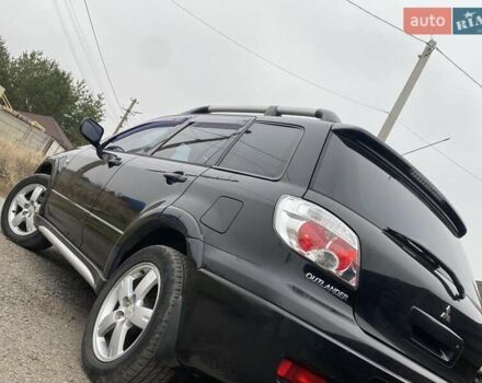 Черный Мицубиси Аутлендер, объемом двигателя 2.4 л и пробегом 178 тыс. км за 6900 $, фото 22 на Automoto.ua