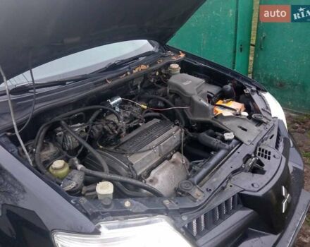 Чорний Міцубісі Аутлендер, об'ємом двигуна 2 л та пробігом 220 тис. км за 5599 $, фото 4 на Automoto.ua