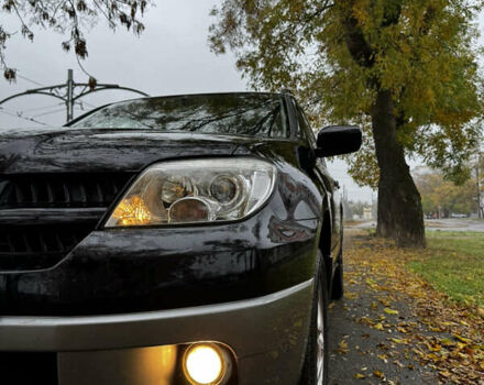 Чорний Міцубісі Аутлендер, об'ємом двигуна 2 л та пробігом 254 тис. км за 7499 $, фото 4 на Automoto.ua